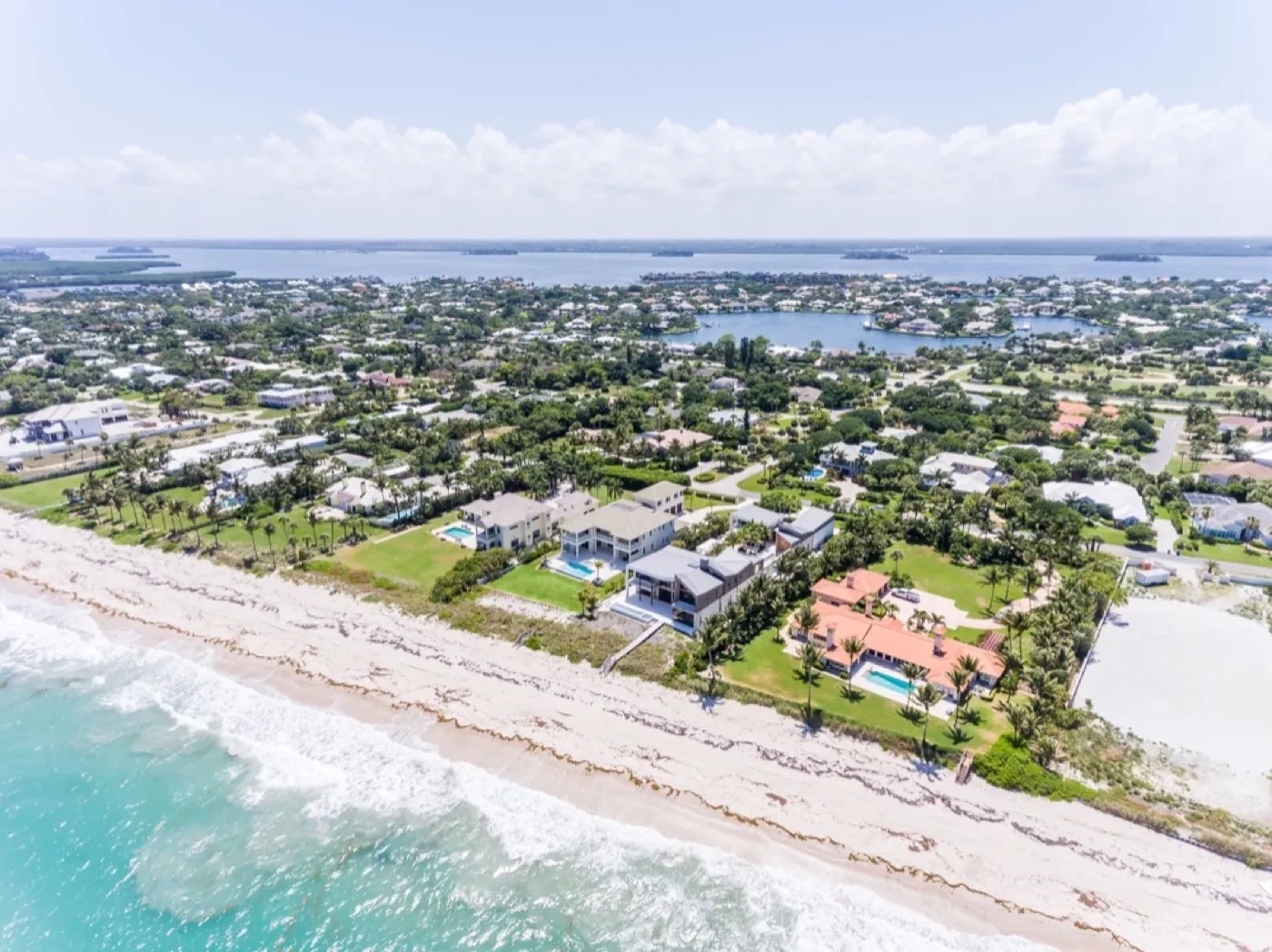 Oceanfront estates and private beach at The Moorings from above the Atlantic surf