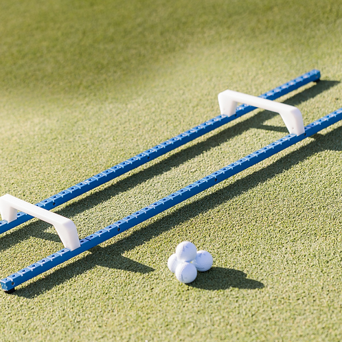 The Grail putting trainer on the green