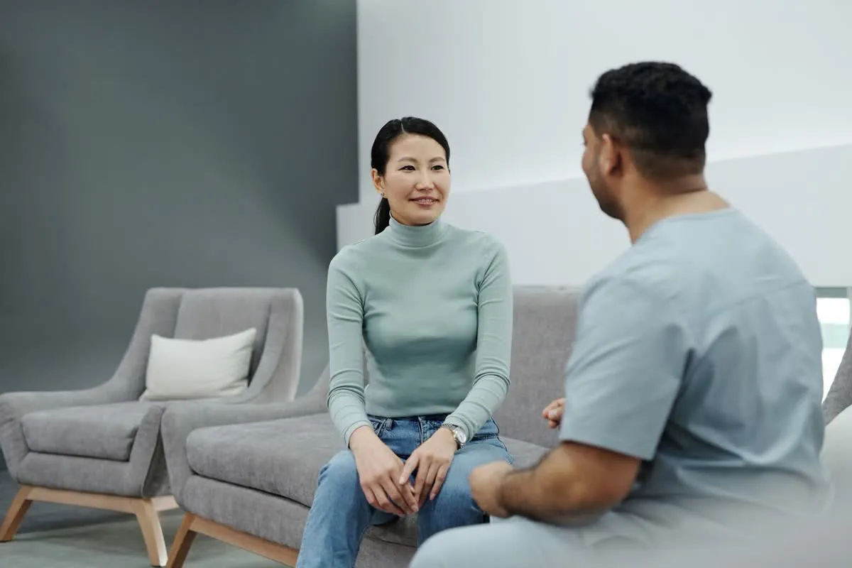 A patient talking with a friendly eye-care team member at Tropical Eye Associates